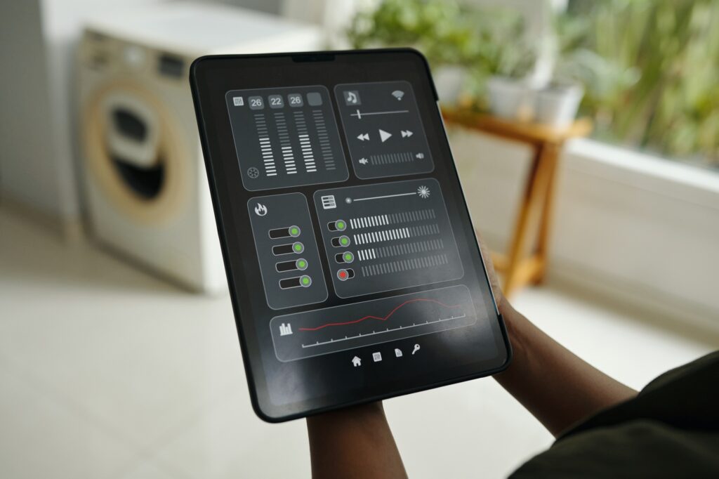 Holding Tablet Displaying Modern Home Automation Interface